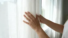 Instead of pouring it into a glass, pour it into the washing machine. Your gray curtains will look like new again.