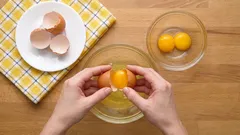 How to crack an egg so that no shell gets in and the yolk stays intact? Just don't use a bowl or a knife.